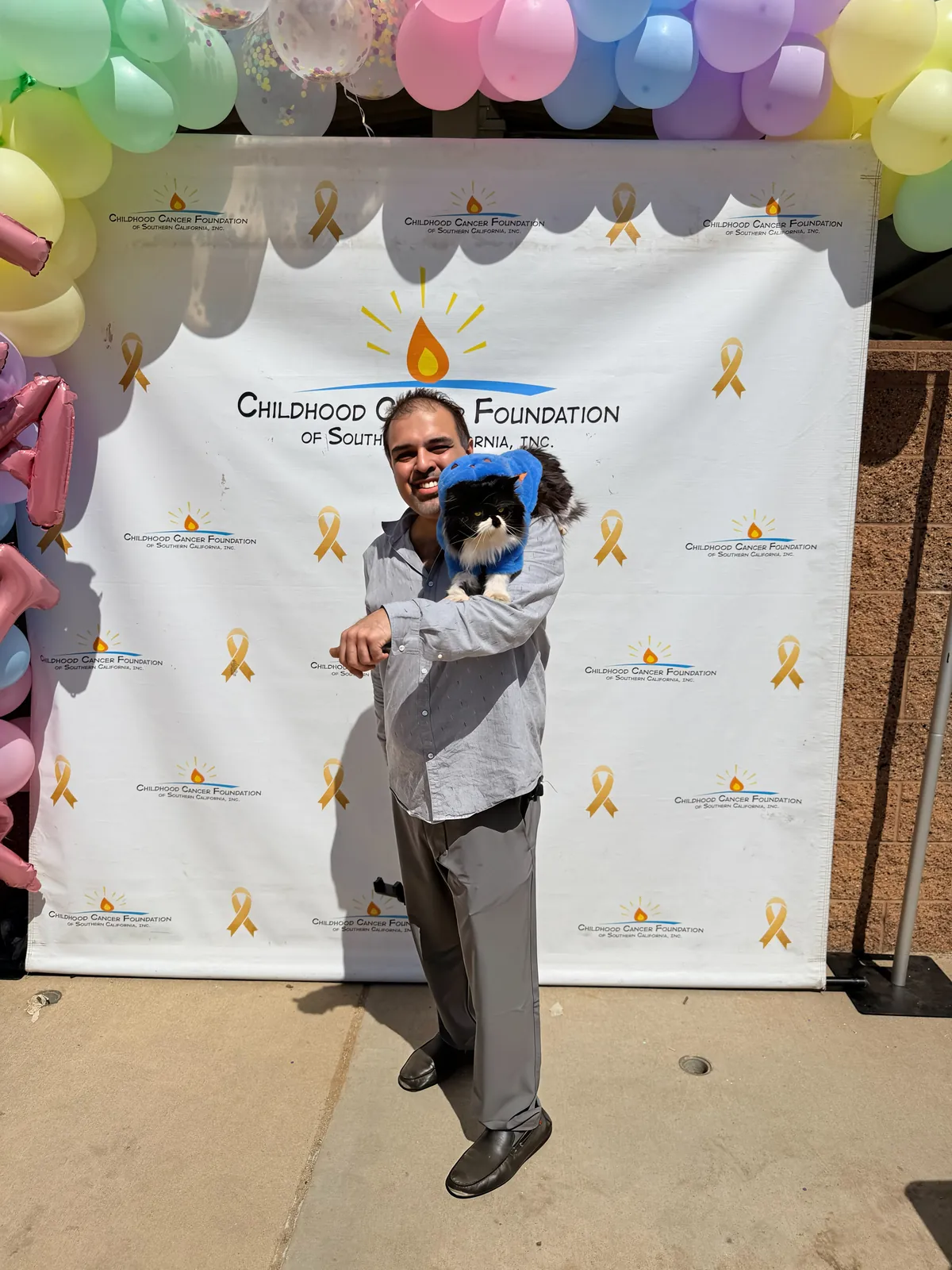 Sassan Darian with Cyrus the Persian cat, mascot of the Cyrusmeowgreat nonprofit